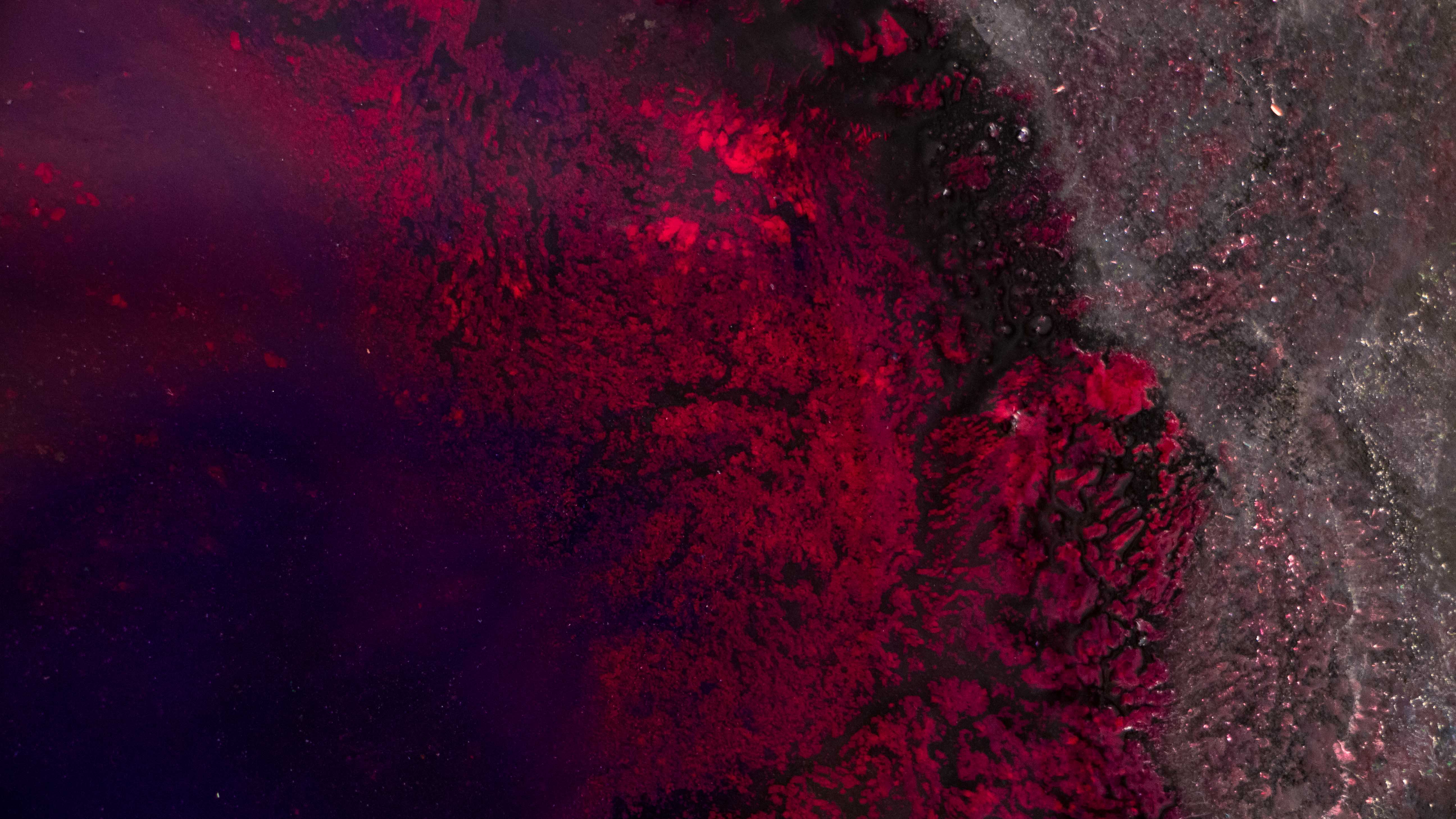 Ink in melted ice - red